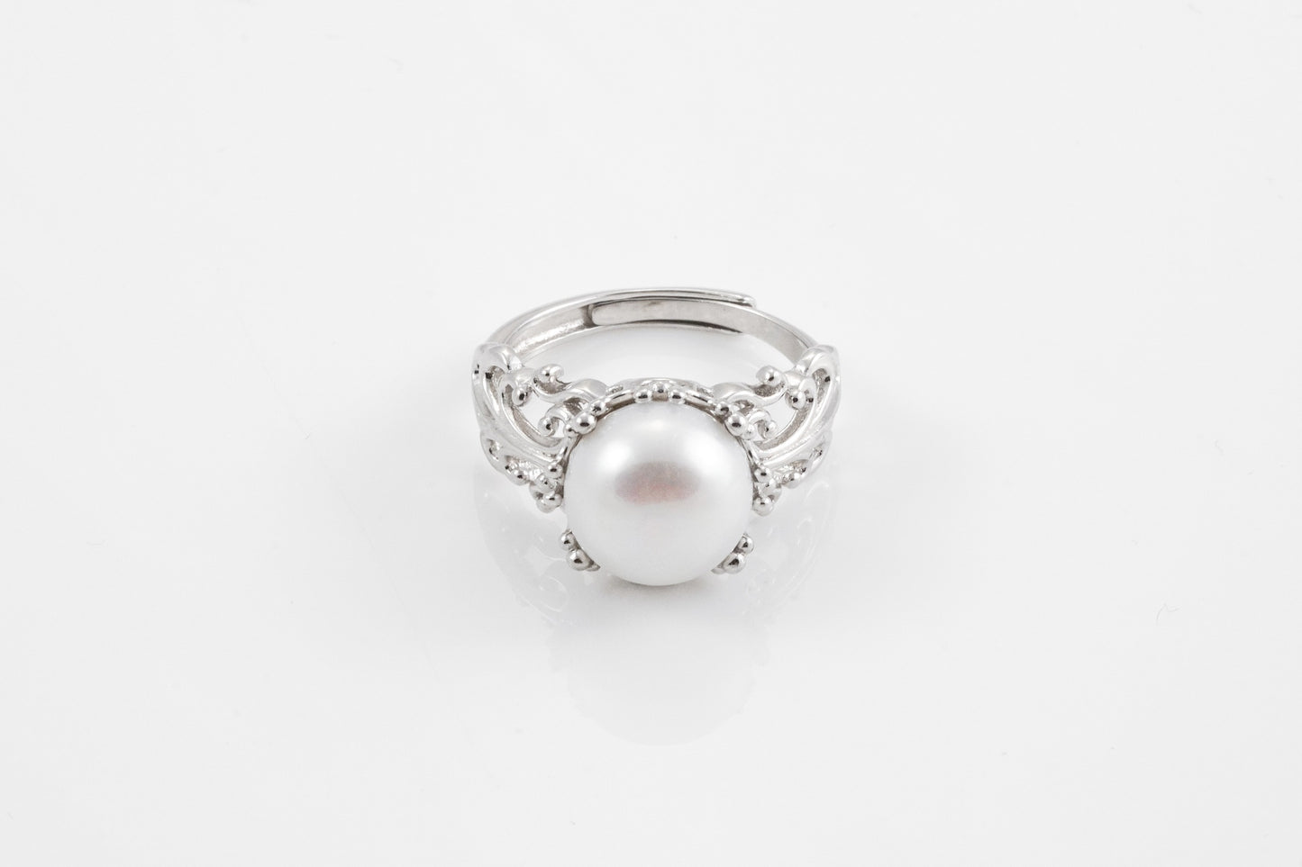 Carved silver pearl ring